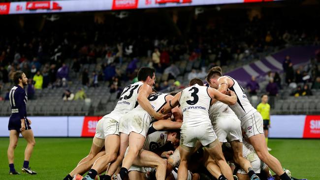 Jack Newnes’ Carlton teammates mob him in celebration after he kicked the match-winning goal against Fremantle in 2020. Getty Images