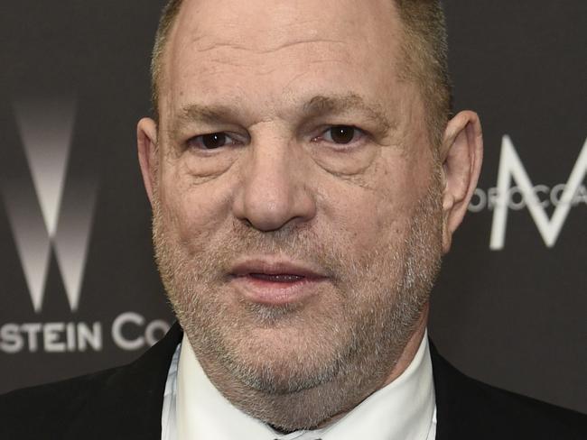 FILE - In this Jan. 8, 2017, file photo, Harvey Weinstein arrives at The Weinstein Company and Netflix Golden Globes afterparty in Beverly Hills, Calif. Weinstein is accused by dozens of women of sexual harassment or assault. He was fired by The Weinstein Co., expelled from various professional guilds and is under investigation by police departments in New York, London, Beverly Hills and Los Angeles. He denies all allegations of non-consensual sex, but he has apologized for causing "a lot of pain" with "the way I've behaved with colleagues in the past." (Photo by Chris Pizzello/Invision/AP, File)