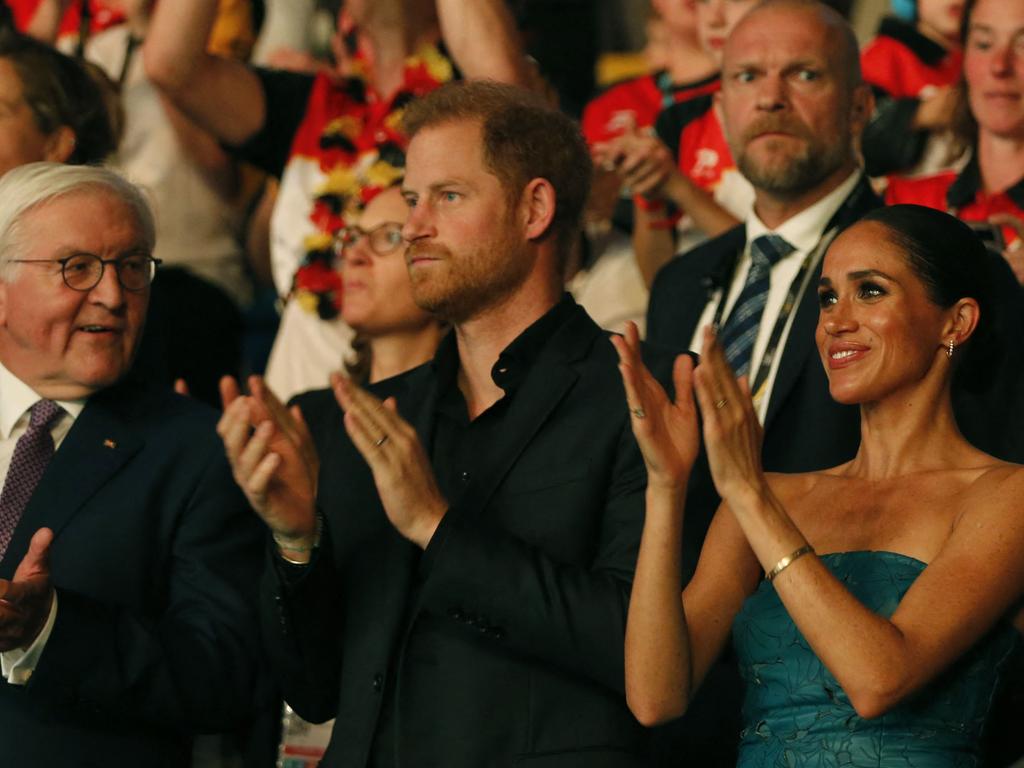 German President Frank-Walter Steinmeier alongside Prince Harry and Ms Markle at the closing ceremony.