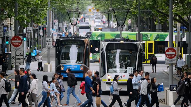 MELBOURNE, AUSTRALIA - NewsWire Photos October 23, 2022: People are pictured in Melbourne's CBD after Treasurer Jim Chalmers revealed a last minute hit to the federal budget that will cost Australians $33bn. Picture: NCA NewsWire / Luis Ascui