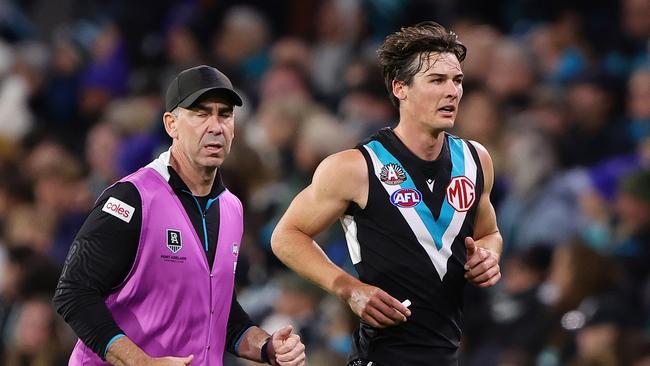 ADELAIDE, AUSTRALIA - APRIL 26: Connor Rozee of the Power taken from the ground with hamstring injury during the 2024 AFL Round 07 match between the Port Adelaide Power and the St Kilda Saints at Adelaide Oval on April 26, 2024 in Adelaide, Australia. (Photo by Sarah Reed/AFL Photos via Getty Images)