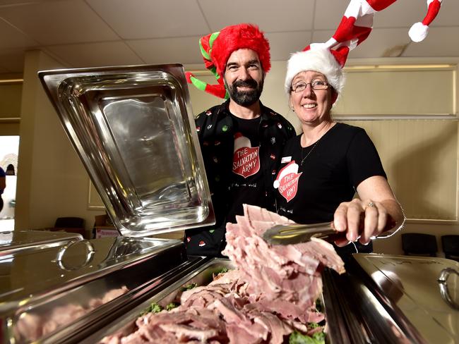 Salvation Army Corps Officer Lieutenant Bronwyn Lithgow and partner Salvation Army Corps Officer Lieutenant Perry Lithgow are getting ready to serve Christmas lunch at the Salvation Army Christmas luncheon in Townsville. PICTURE: MATT TAYLOR.