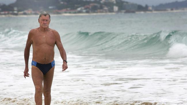 John Cunningham, pictured at Kirra Beach, is a legendary lifesaver who was chief lifeguard for 32 years.