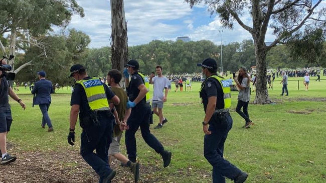 A protester is arrested. Picture: Caroline Schelle