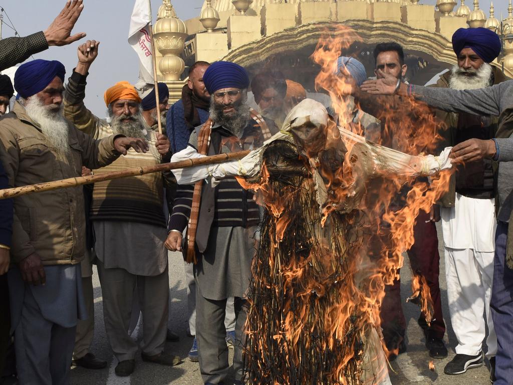 Protesters burn an effigy of Narendra Modi. Picture: Narinder Nanu/AFP