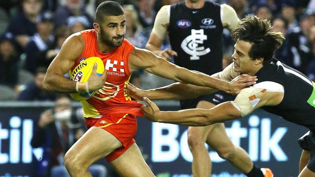 Adam Saad fends off Jack Silvagni. Picture: George Salpigtidis