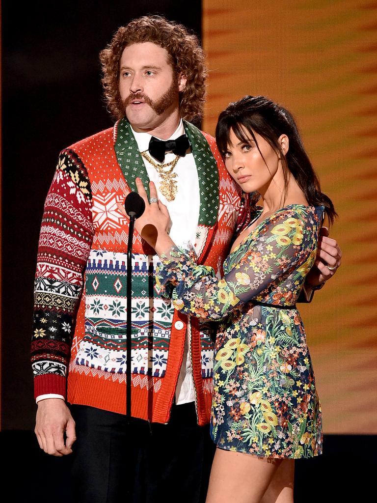 Actors T.J. Miller and Olivia Munn speak onstage during the 2016 American Music Awards at Microsoft Theater on November 20, 2016 in Los Angeles, California. Picture: Getty