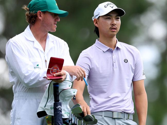 AUGUSTA, GEORGIA - APRIL 11: Min Woo Lee of Australia and his caddie prepare for a shot from the fourth tee during the first round of the 2024 Masters Tournament at Augusta National Golf Club on April 11, 2024 in Augusta, Georgia.   Andrew Redington/Getty Images/AFP (Photo by Andrew Redington / GETTY IMAGES NORTH AMERICA / Getty Images via AFP)