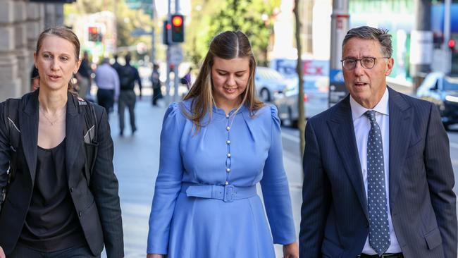 Teresa Ward, next to Higgins and Leon Zwier arrive at David Malcolm Justice Centre in Perth. Picture: Colin Murty