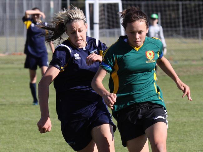 Alanna Kennedy and Caitlin Foord jostle for the ball playing in the Bill Turner Trophy grand final. Picture: Lloyd Turner