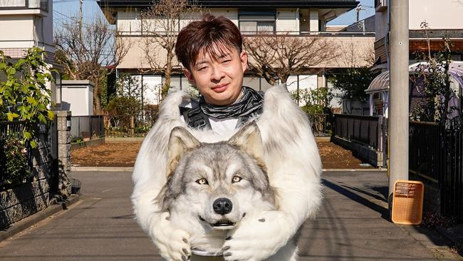 Toru Ueda spent a staggering three million Japanese yen to fulfil his childhood dream of being a wolf by having a full-size wolf suit created for him. Picture: News Licensing/Mega