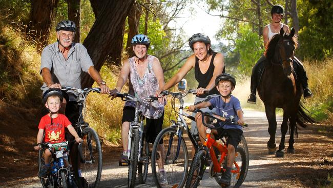 Mal and Diane Poulton, the Spence's Simone, Owen, 4, and Ethan, 6, and Lauren Howes, 22, on Remi on the Lilydale to Warburton Rail Trail.