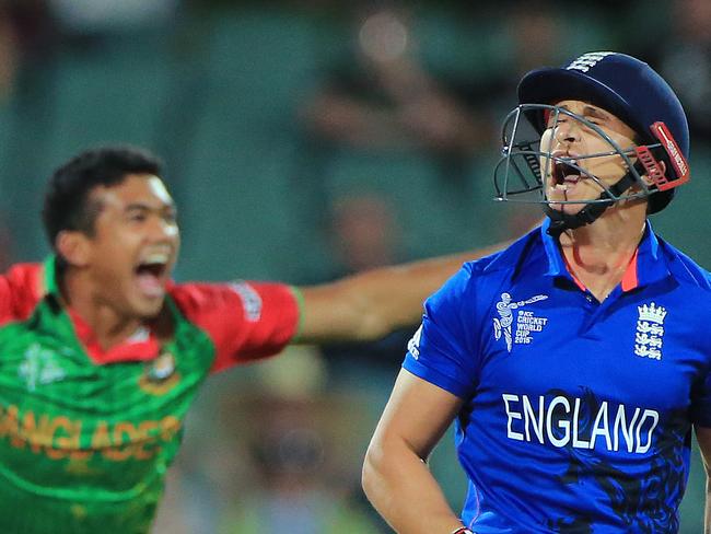 England batsman James Taylor reacts after he was dismissed by Bangladesh bowler Taskin Ahmed, left, during their Cricket World Cup Pool A match in Adelaide, Australia, Monday, March 9, 2015. (AP Photo/James Elsby)