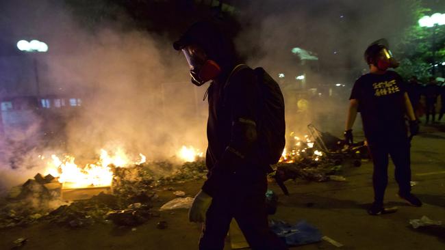 Protesters scout the area outside the Hong Kong Polytechnic University on Sunday.