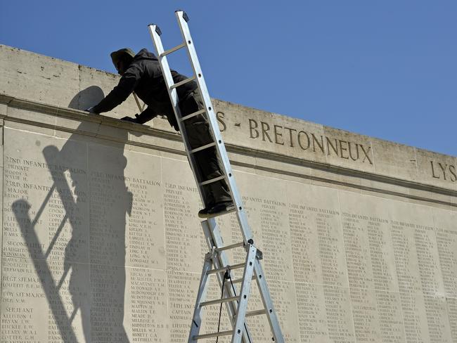 A French worker works on the honour board at the centre. Picture: David Dyson