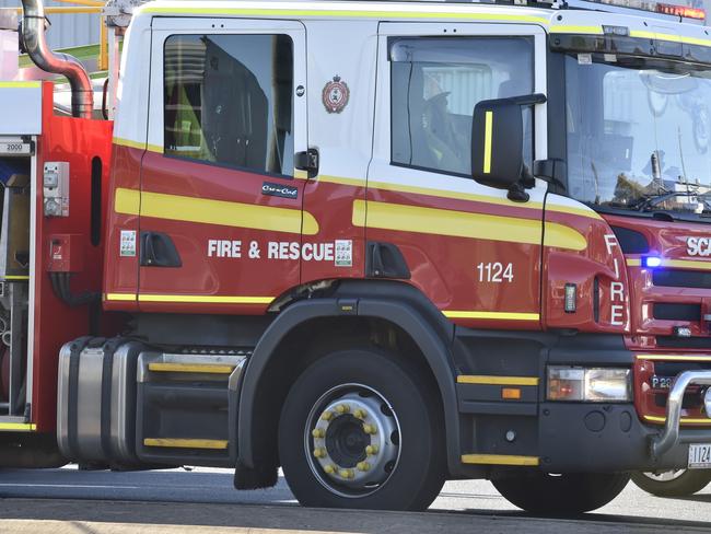 Firefighters on scene of burnt-out ute on country road