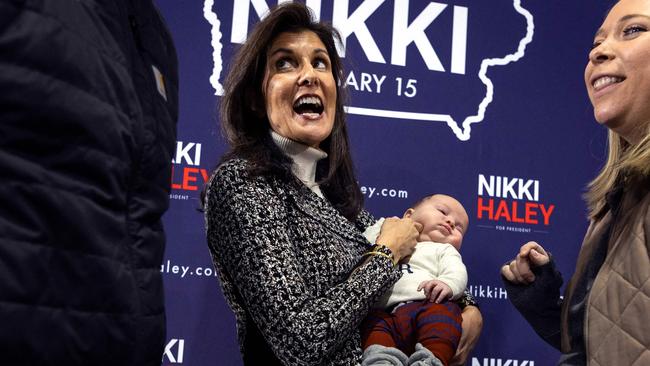 Former UN ambassador and 2024 presidential hopeful Nikki Haley holds a baby during a Town Hall event in Agency, Iowa, on December 19, 2023. Picture: Christian Monterrosa/AFP