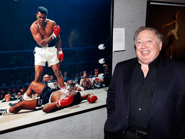 Photographer Neil Leifer poses next to his famous Muhammad Ali shot during an exhibition in 2009.