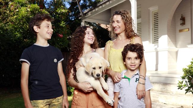 Alex Clyde, with kids Isabella, Leonardo, Marlow and puppy Enzo, are trying to buy in Mosman, where demand is rising. Picture: Tim Hunter.