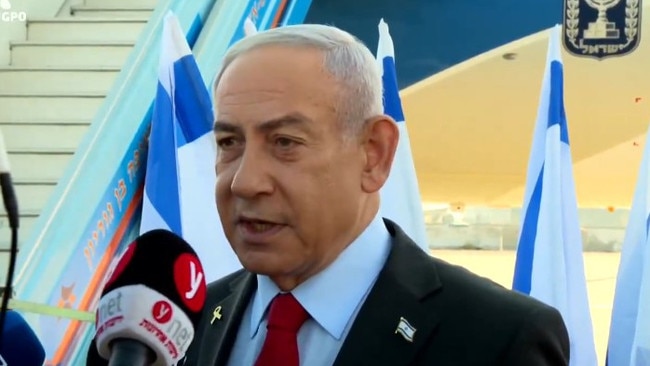 Israeli Prime Minister benjamin Netanyahu speaks to reporters before he gets on a plane to Washington.