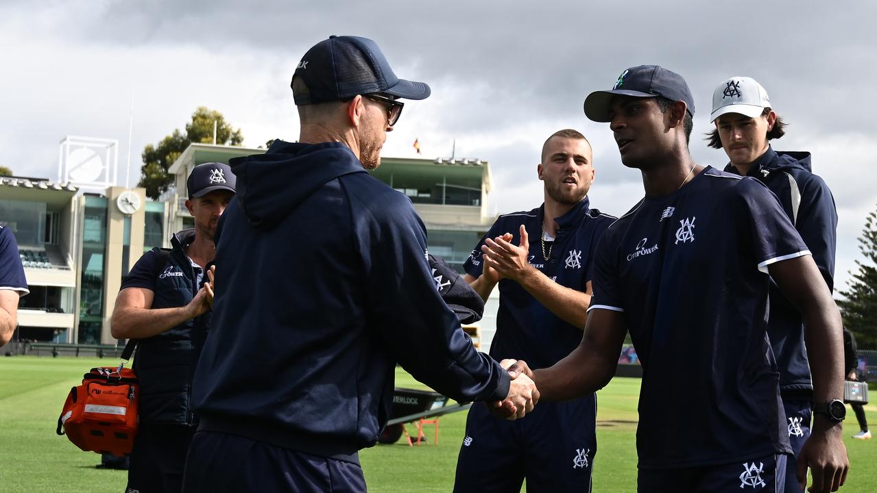 Ashley Chandrasinghe receives his debut cap from Chris Rogers. Picture: Steve Bell/Getty Images