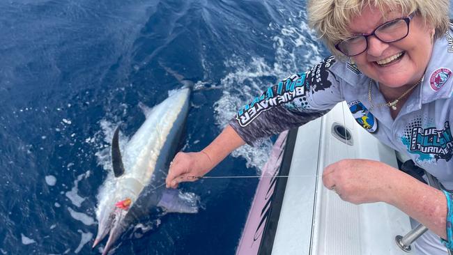 08/09/2022 – Terri Morgan with one of two small black Marlin she tagged during the Cairns Bluewater Billfish Tournament last weekend. Picture: Robert Erskine