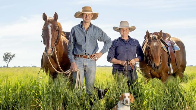 Jacinta Taylor and son James on their Tandarra property with his quarter horse stallion named Syd, her quarter horse Sassy, their Kelpie named Flo and Beagle named Clive. Picture: Zoe Phillips
