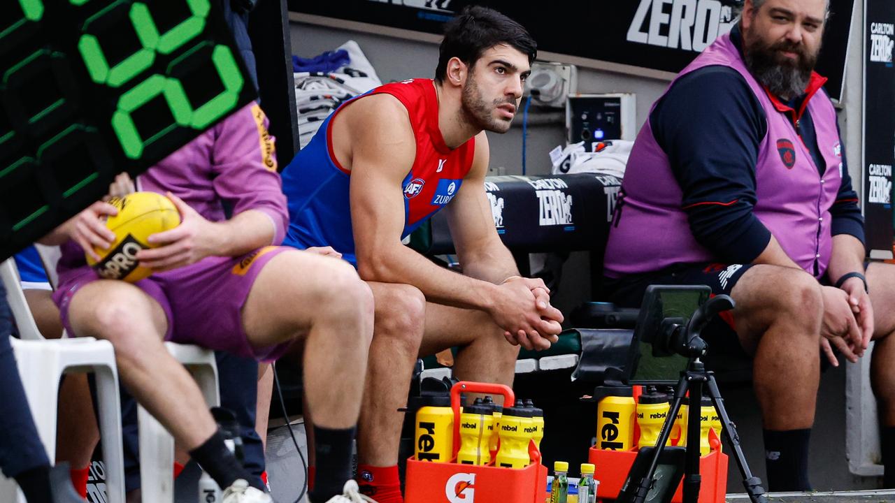 Christian Petracca of the Demons is seen on the bench after leaving the ground with a rib injury during the 2024 AFL Round 13 match between the Collingwood Magpies and the Melbourne Demons at The Melbourne Cricket Ground on June 10, 2024 in Melbourne, Australia. (Photo by Dylan Burns/AFL Photos via Getty Images)