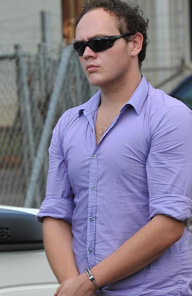 Zak Grieve in handcuffs in Katherine as members of the jury and lawyers view the scene of the crime during his trial. File picture