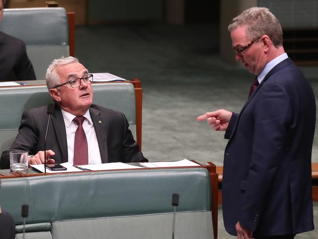 Andrew Wilkie talking with Christopher Pyne during Question Time in the House of Representatives Chamber at Parliament House in Canberra. Picture Kym Smith