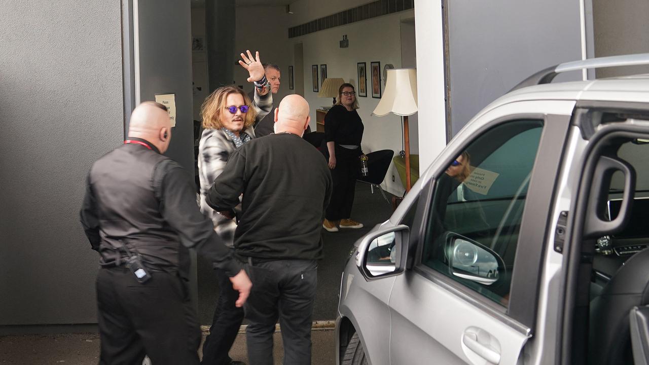 Johnny Depp waves upon arrival at the Sage Gateshead venue, in Newcastle-upon-Tyne, north east England, on June 2 to appear on stage with British guitarist and musician Jeff Beck. (Photo by AFP)