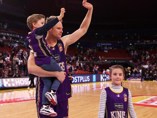 Brad Newley leaves the court with his children after playing his 250th NBL match during the round 21 NBL match between Sydney Kings and Brisbane Bullets at Qudos Bank Arena. Photo: Mark Kolbe/Getty Images.
