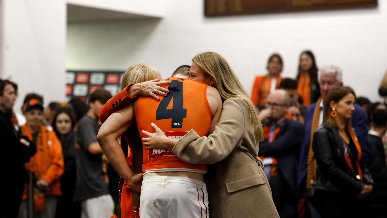 Toby Greene is consoled by family after the one-point loss in last year’s prelim. Photo: Phil Hillyard