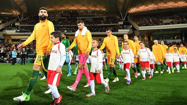 Mile Jedinak of Australia leads his players onto the ground before the Socceroos’ clash with Saudi Arabia at Adelaide Oval in June, 2017. Photo by Daniel Kalisz/Getty Images.