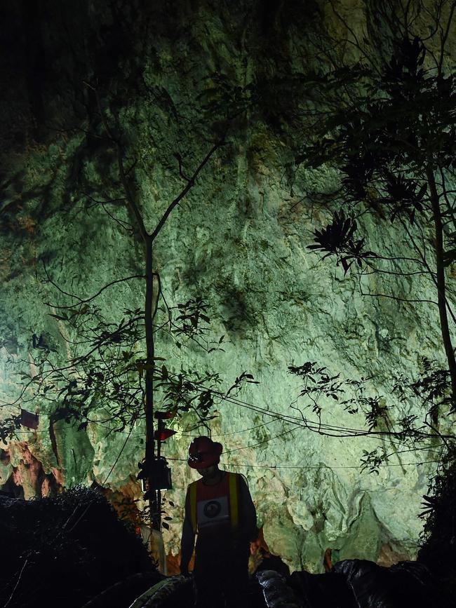 A Thai technician emerges from the mouth of Tham Luang cave. Picture: AFP