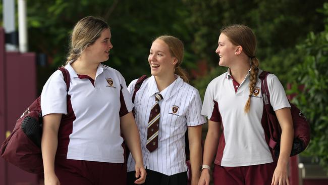 New Australian swimming star Ella Ramsay, back school at St Peters Lutheran College with school friends Victoria Kuhn 17, and Ella Kreutzer 16. Pics Adam Head