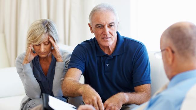 Senior couple clearing their doubts with the financial planner. financial advice, adviser, planner, stress, money generic