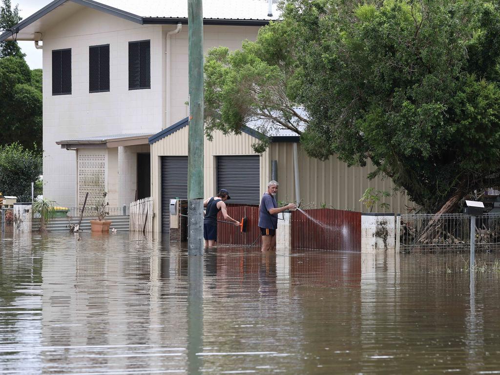 The clean up in Ingham starts as fresh fears emerge for residents. Picture: Adam Head