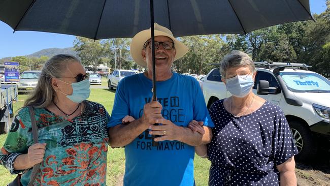 Robyn Lawrence, current councillor and mayoral candidate George Cecato and Joan Kirk sheltering from the sun. Picture: Janine Watson