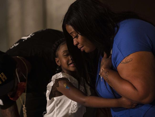 Roxie Washington embraces her daughter Gianna Floyd. Picture: Getty Images/AFP