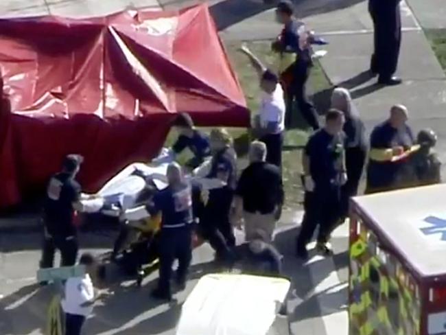 Victims being transported into waiting ambulances. Picture: Telemundo