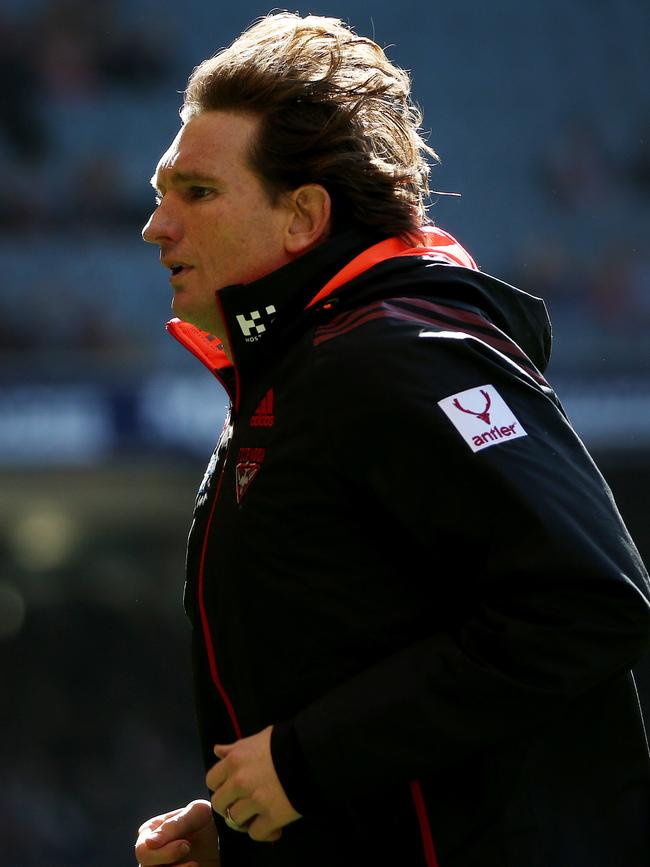 James Hird leaves the field during a game in 2013.