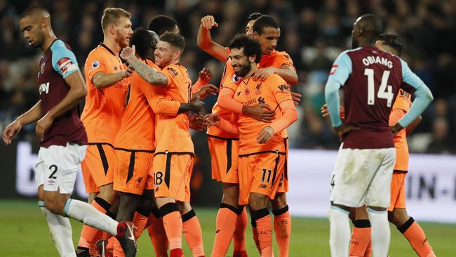 Liverpool’s Mohamed Salah celebrates with teammates after scoring his side’s fourth goal against West Ham.