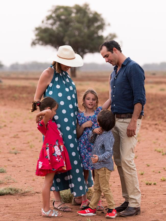 Grace Brennan with her family on their farm in Warren in regional NSW.