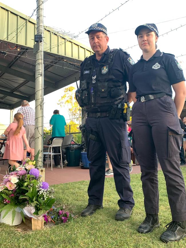 Constable Katie Lansbury from Goondiwindi and Senior Constable Ian Buckmaster from Warwick at a Chinchilla vigil for fallen Queensland Police officers Constables Rachel McCrow and Matthew Arnold, who were killed on Monday afternoon when they went to a routine welfare check at a Wieambilla property. Picture: Chloe Cufflin