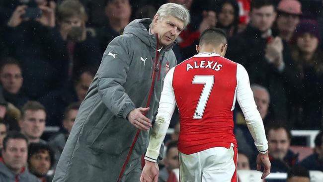 Arsene Wenger embraces Alexis Sanchez of Arsenal.