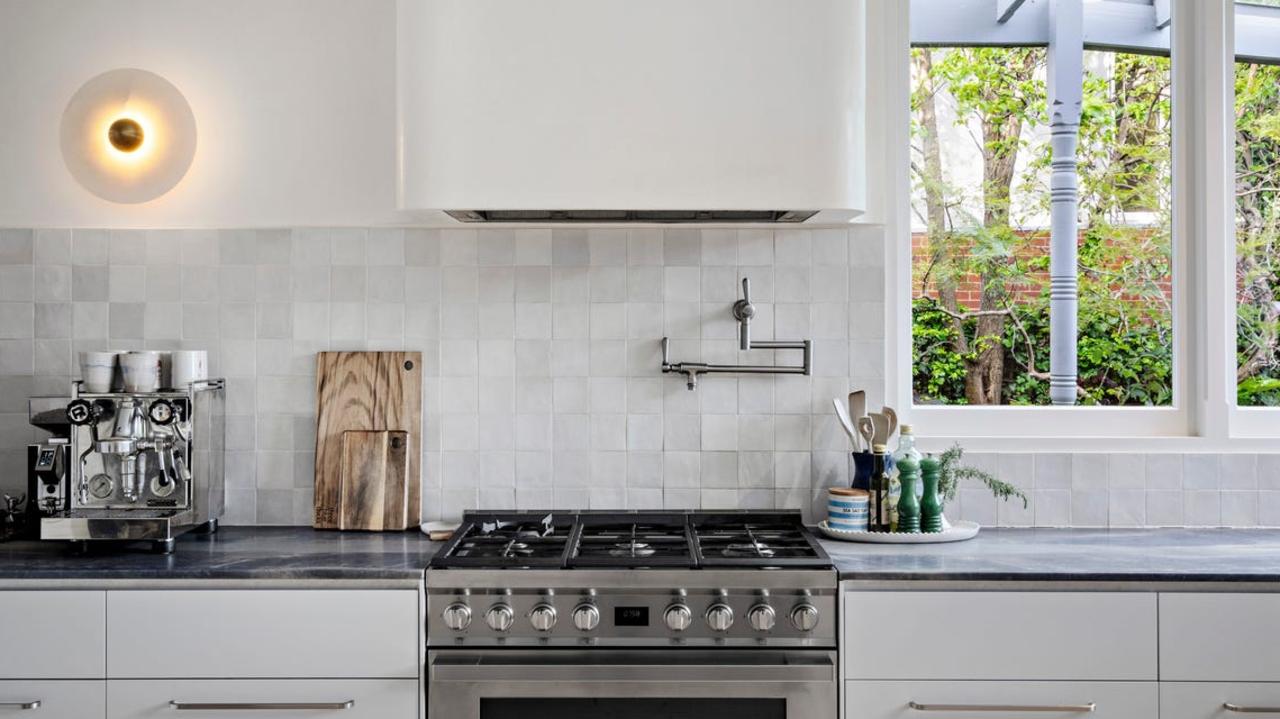 The formal living and dining rooms connect to the kitchen.