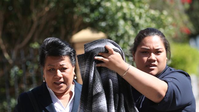 Tovale Kalati leaves Burwood Court after pleading guilty ,while her family try to protect her identity at an earlier court appearance. Picture John Grainger