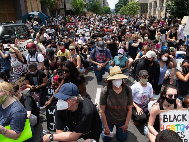 Protesters kneel near the White House in Washington DC. Picture: AFP