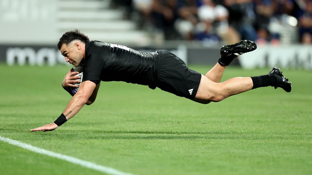 New Zealand's inside centre David Havili dives to score try during the France 2023 Rugby World Cup Pool A match between New Zealand and Namibia at Stadium de Toulouse in Toulouse, southwestern France on September 15, 2023. (Photo by CHARLY TRIBALLEAU / AFP)